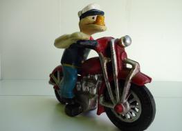 Popeye figure on motorcycle